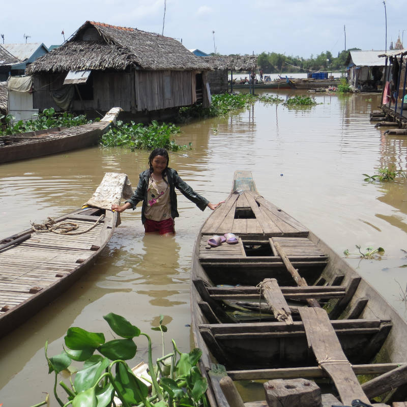 Child in the River with Boats
